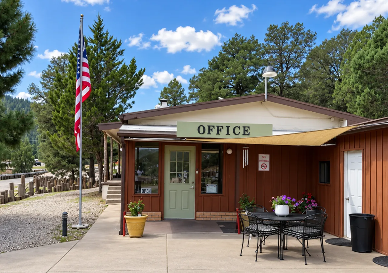 Park office with a porch table, flag, and Office sign