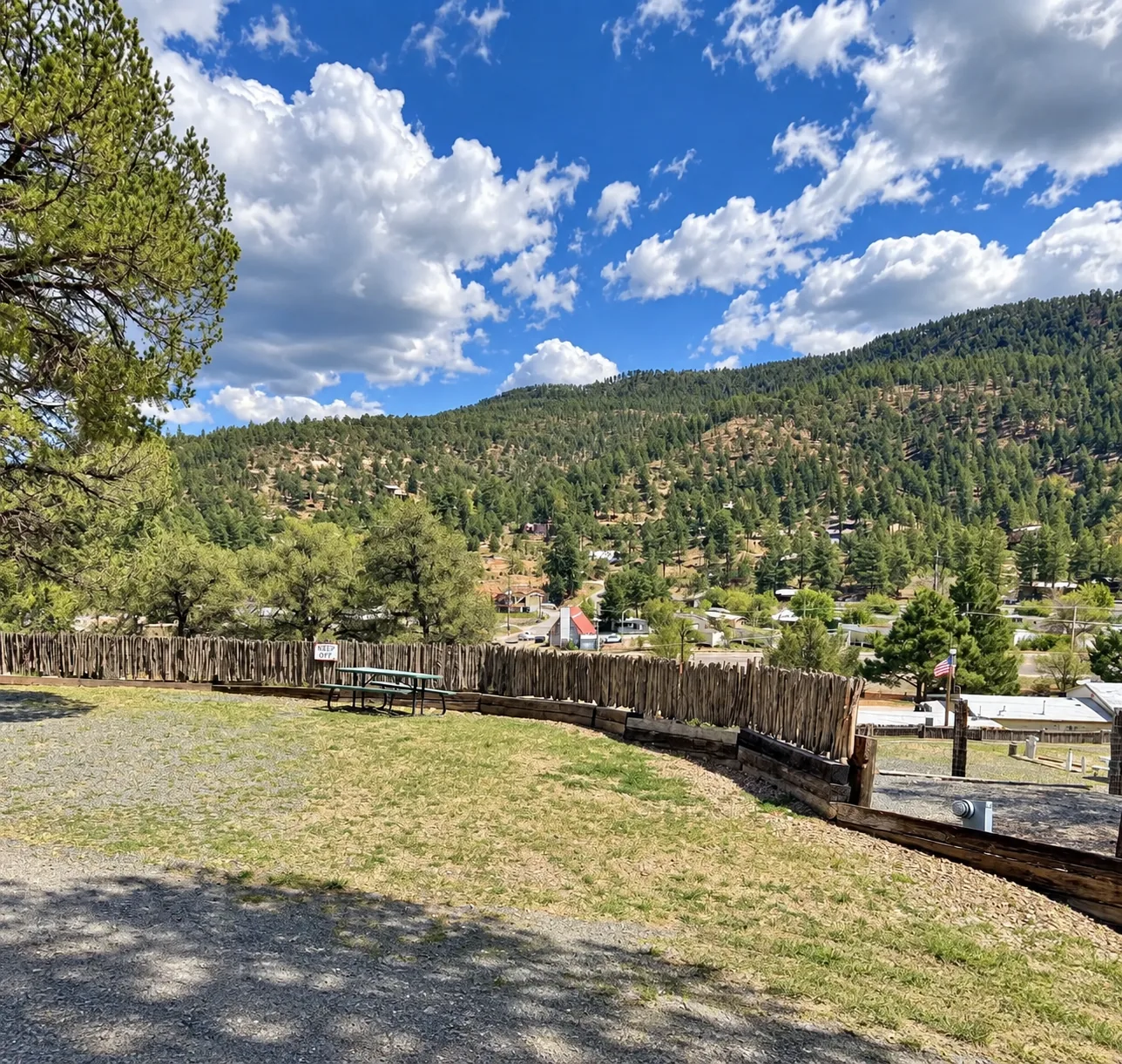 View from an upper terrace across wooded Ruidoso hills