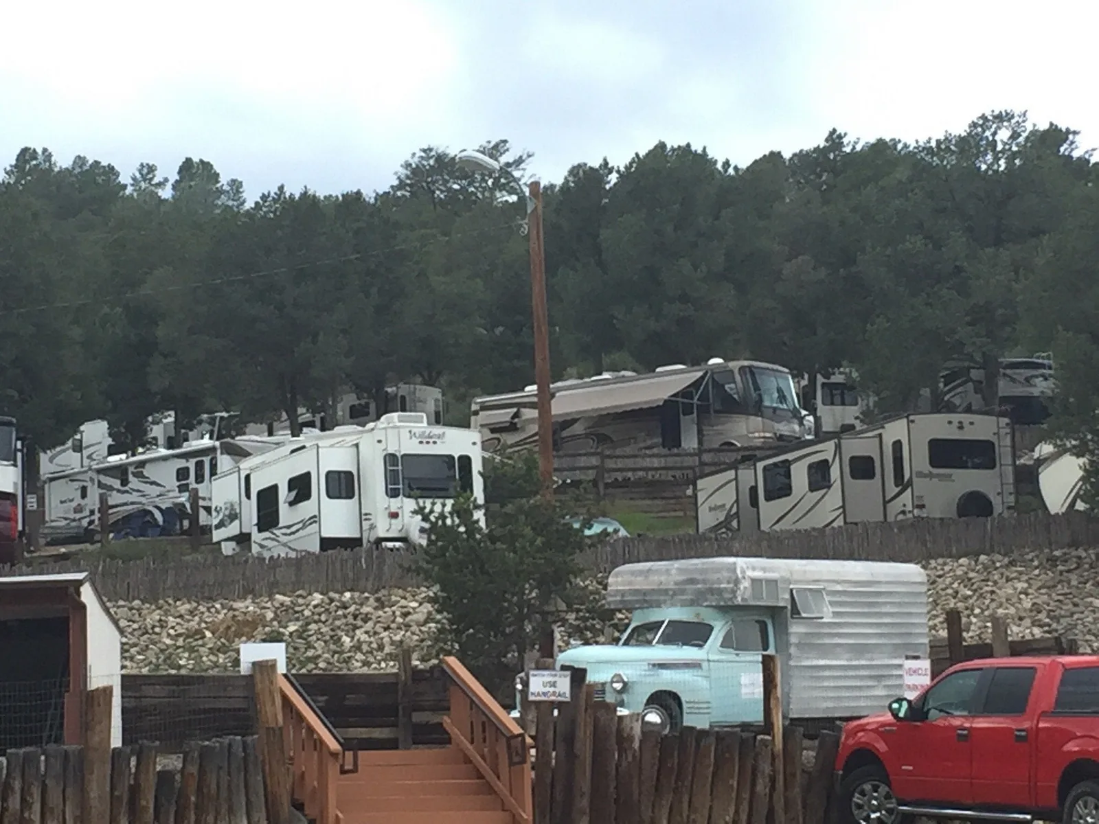 Wide view of the terraced RV park among Ruidoso pines